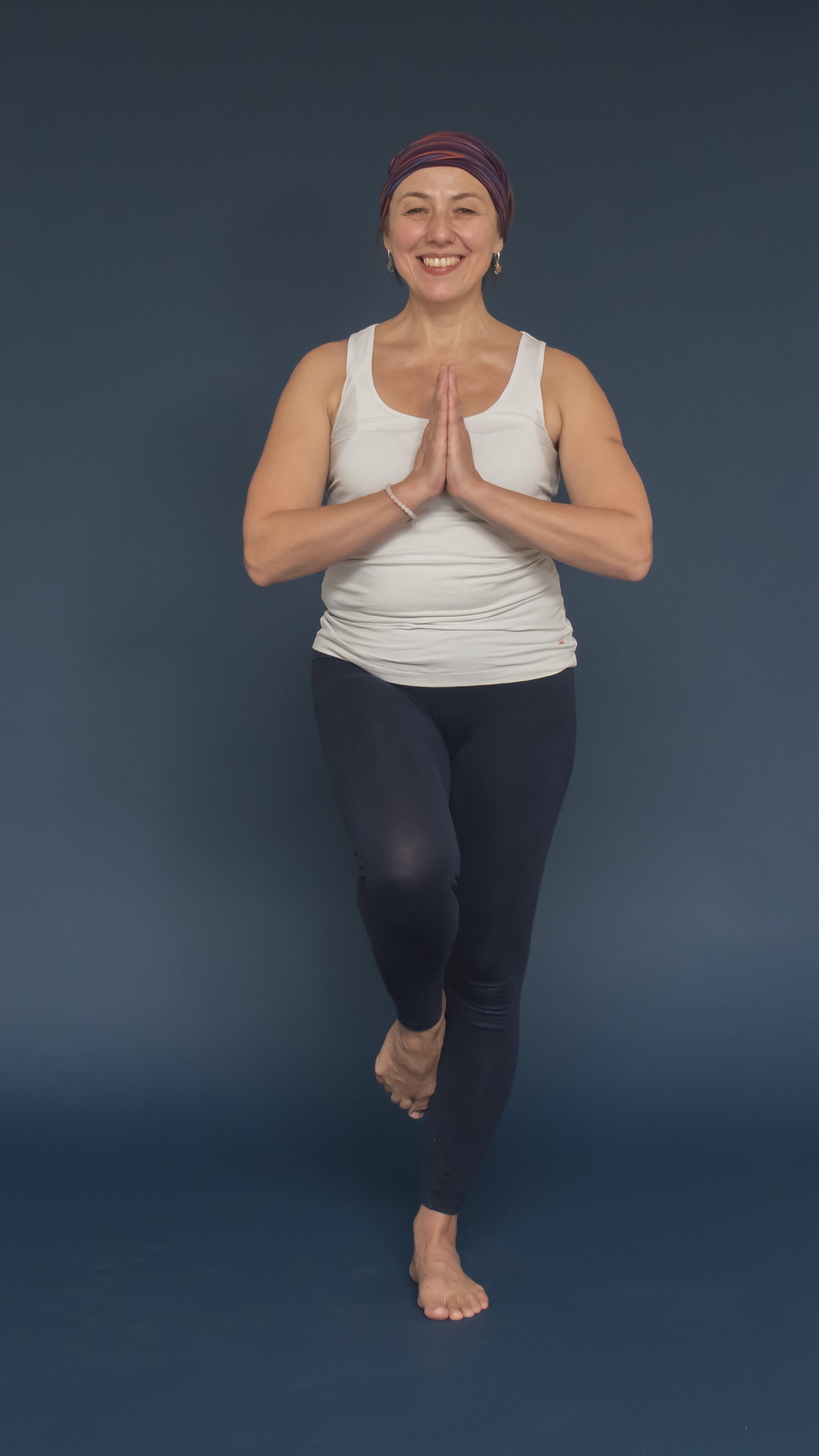 Woman standing in simplified Tree Asana from Yoga